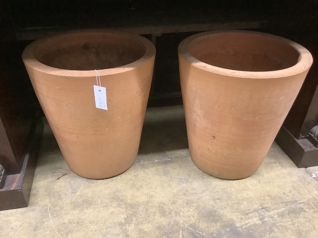 A pair of circular terracotta garden planters, diameter 40cm, height 44cm